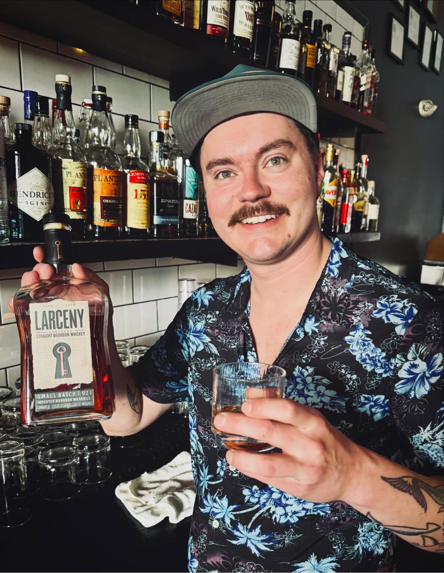 Bartender pouring bourbon at the bar