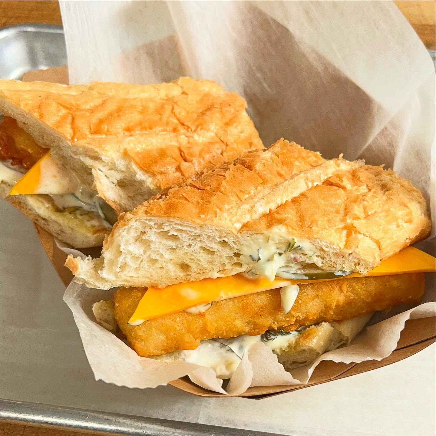 Crispy fish sandwich with toppings