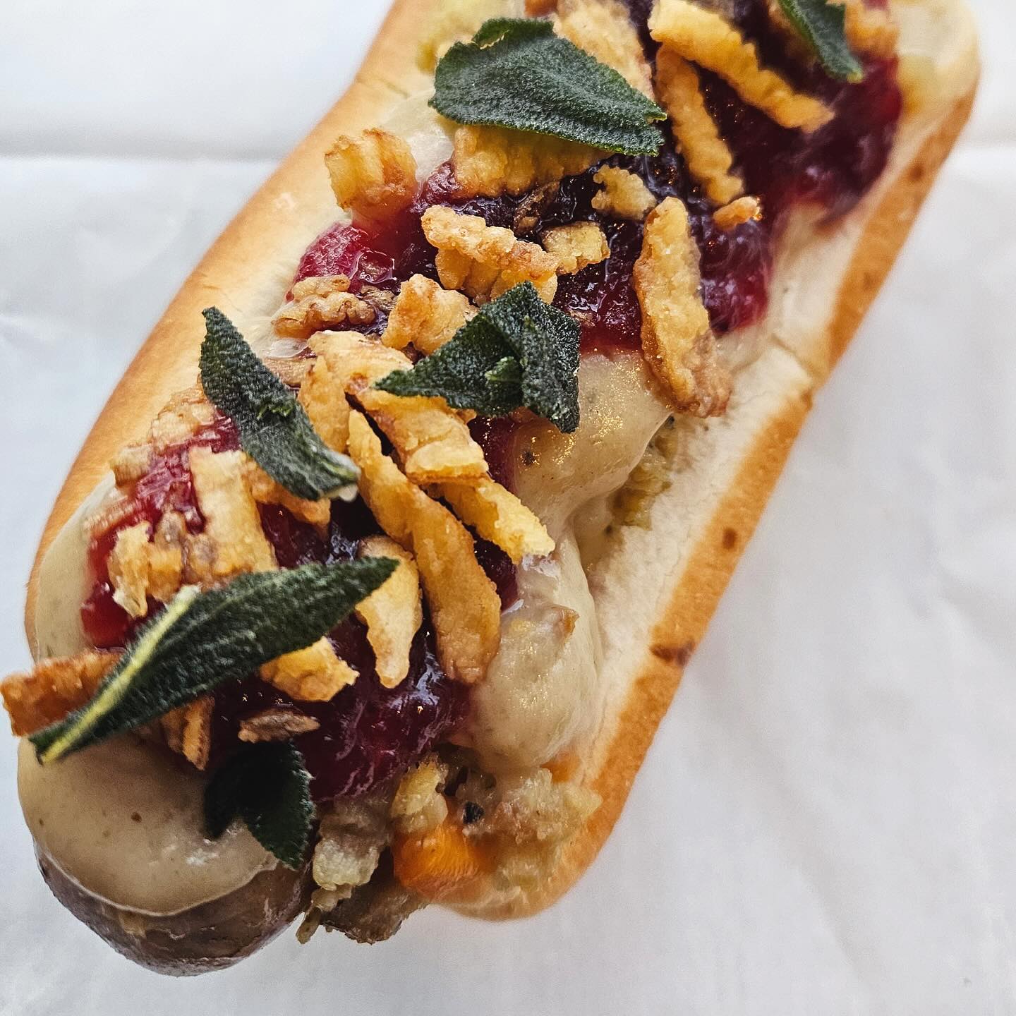Sausage with cranberry sage topping